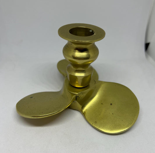 Brass candle stick Propellor shaped candle holder.