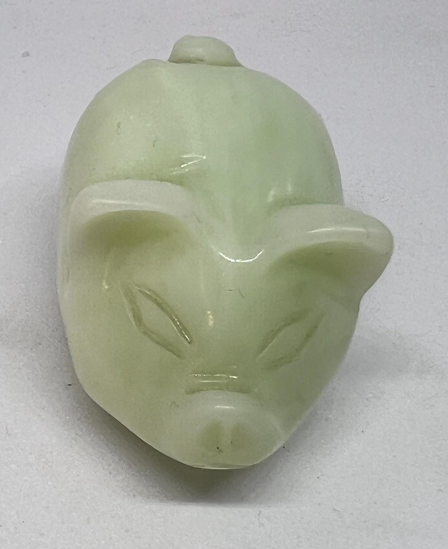 Vintage jade pig figurine. Cute carved white stone jade piglet ornament.