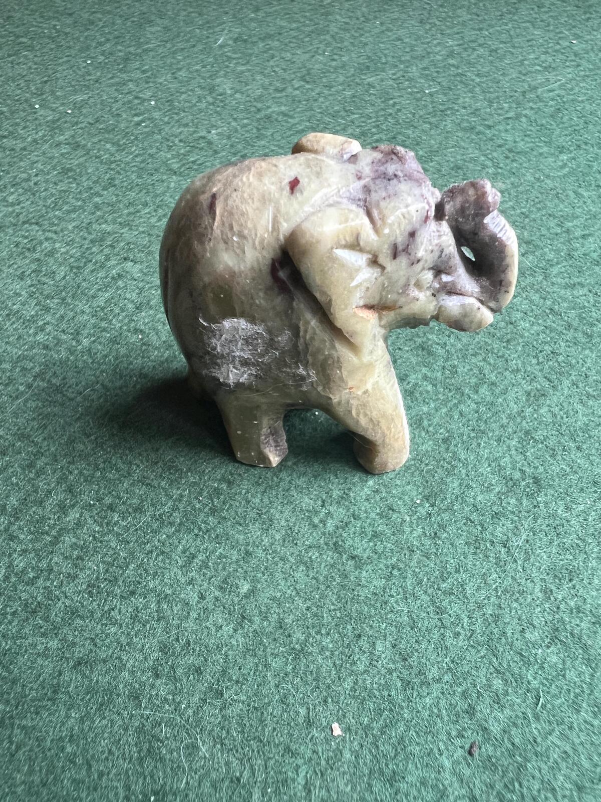 Stone elephant figure. Miniature marble hand carved lucky elephant.