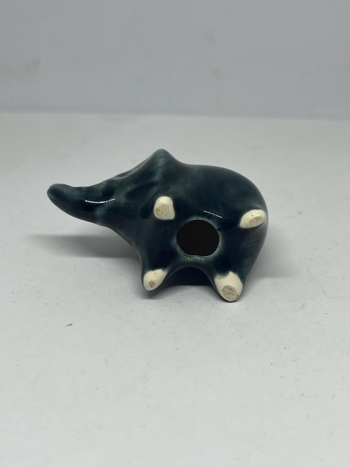Tiny elephant figurine. Wellow pottery Blue green glaze stylised baby elephant.