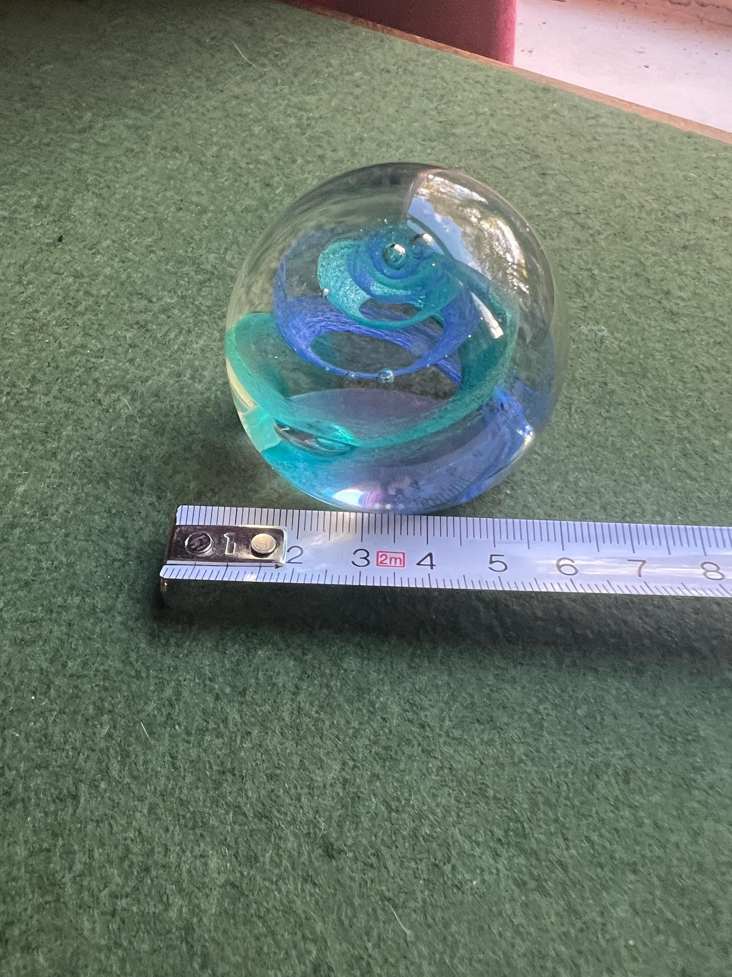 Vintage paperweight. Blue swirl in clear glass. Stamped Twirl Caithness Scotland.