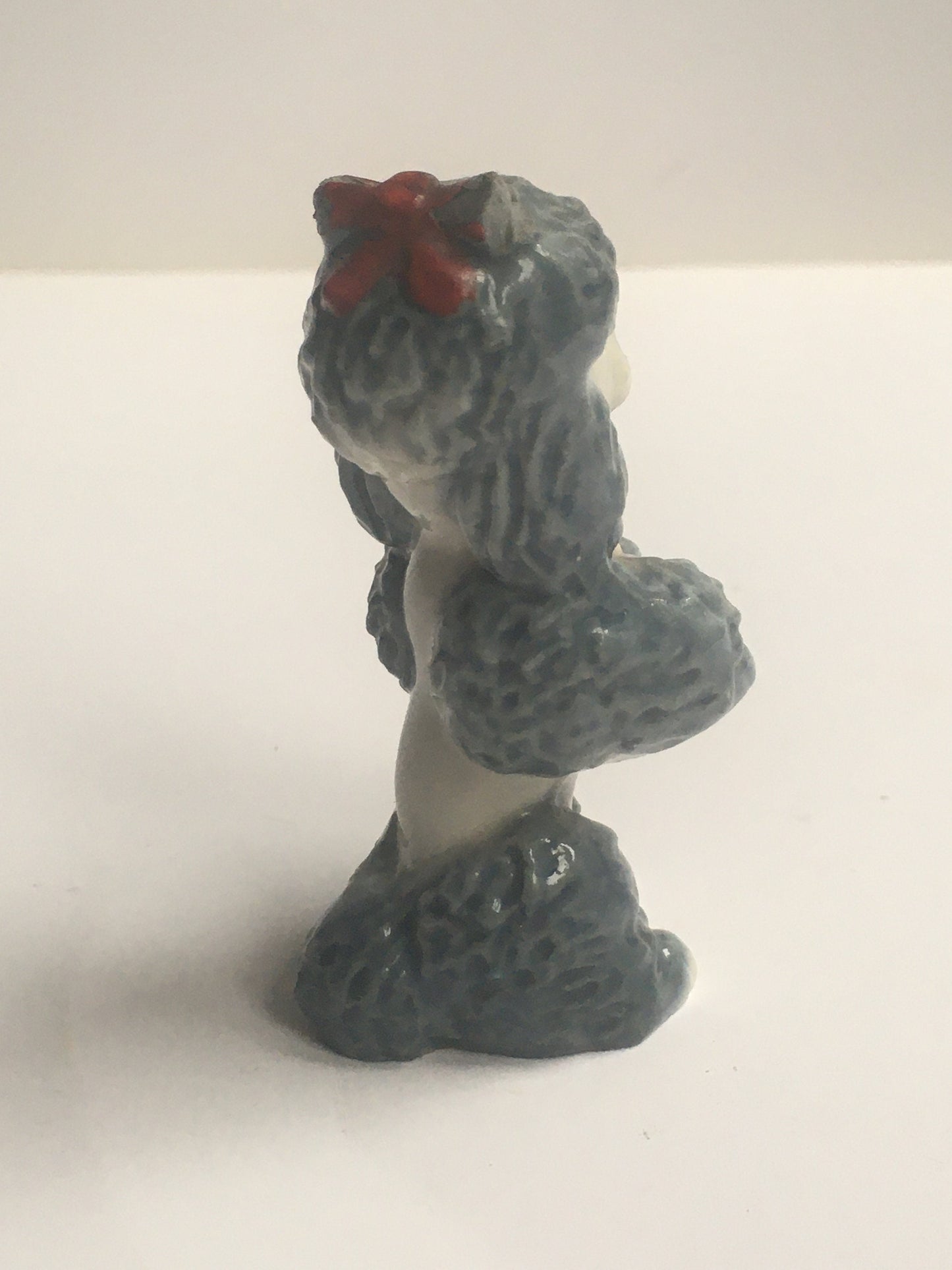 Wade Poodle. Vintage ceramic begging poodle with a red bow.