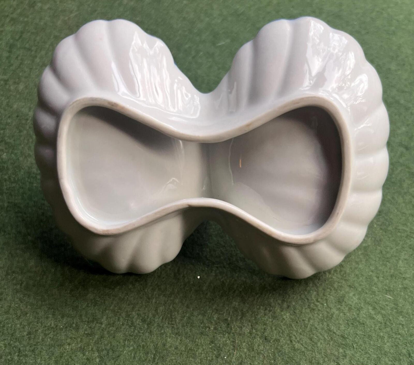 Vintage trinket dish. Ruffle edged handled blue white ceramic shell dish.