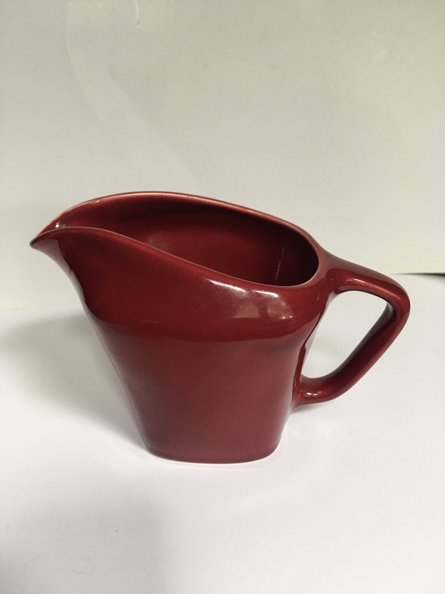 Rare Vintage red milk jug creamer Deep red glazed gravy custard serving jug. Stamped South Seas JG Meakin.