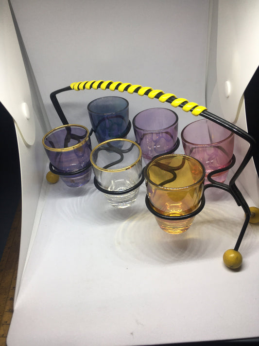 1950s Harlequin glass 6 shot glasses in wire holder.