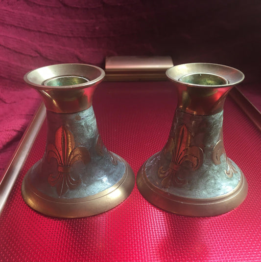 Pair of brass and green enamel candlesticks. Green enamel Fleur de Lis design.