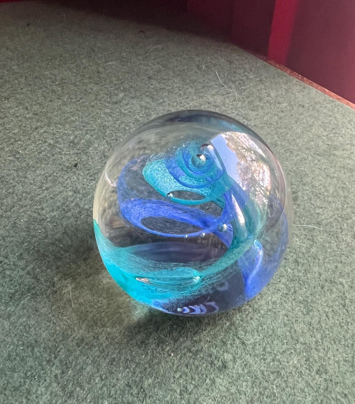 Vintage paperweight. Blue swirl in clear glass. Stamped Twirl Caithness Scotland.
