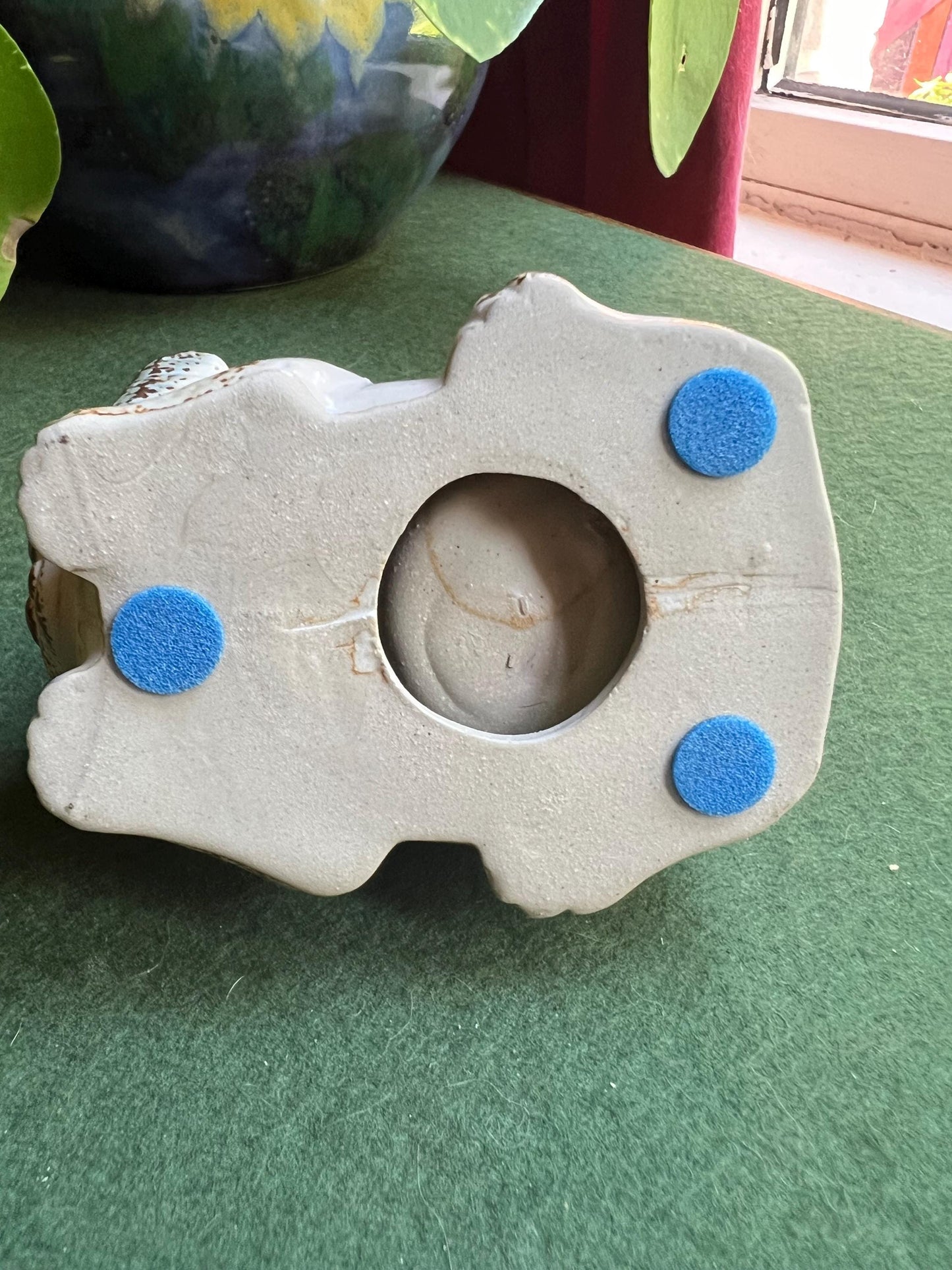 Stylised stone ware lion planter with original 'Julietta' Sticker.