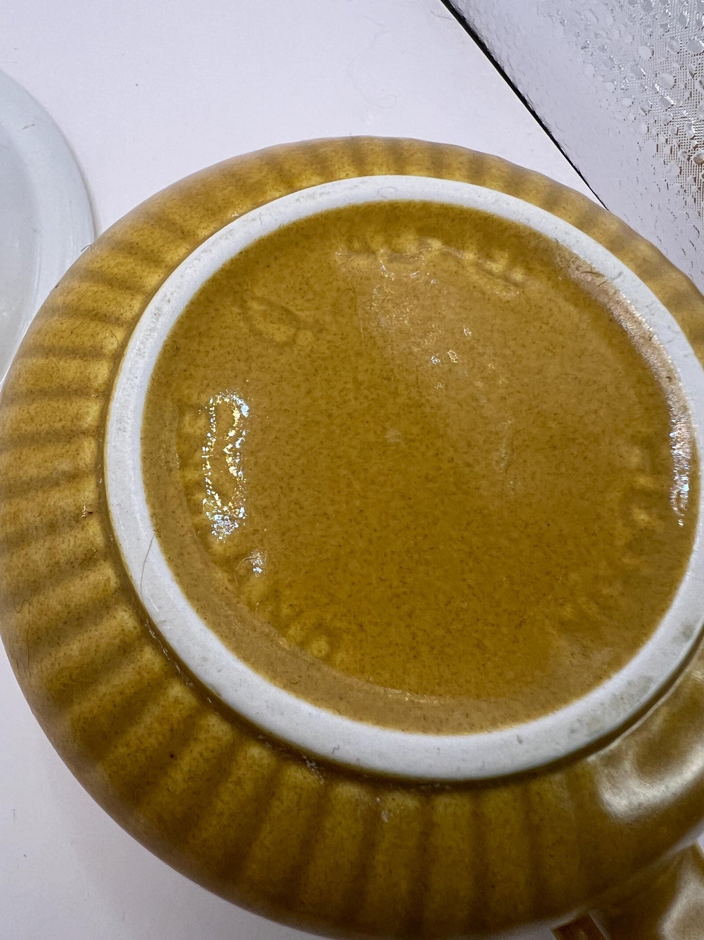 Mustard yellow ceramic gravy sauce boat and saucer. Stamped Glo-white Ironstone Alfred Meakin England.