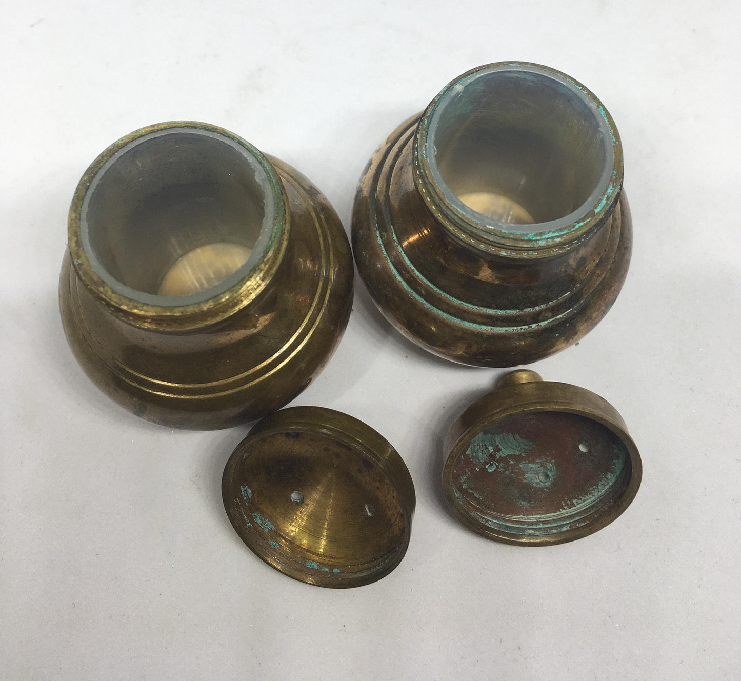Unusual brass salt and pepper shakers. Screw off lids plastic inserts. Some oxidation.