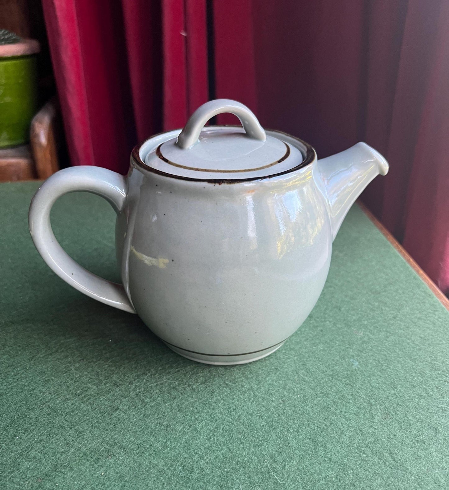 Pot bellied celadon glazed tea coffee pot. Speckled duck egg blue. Stamped Highland Stoneware Scotland.