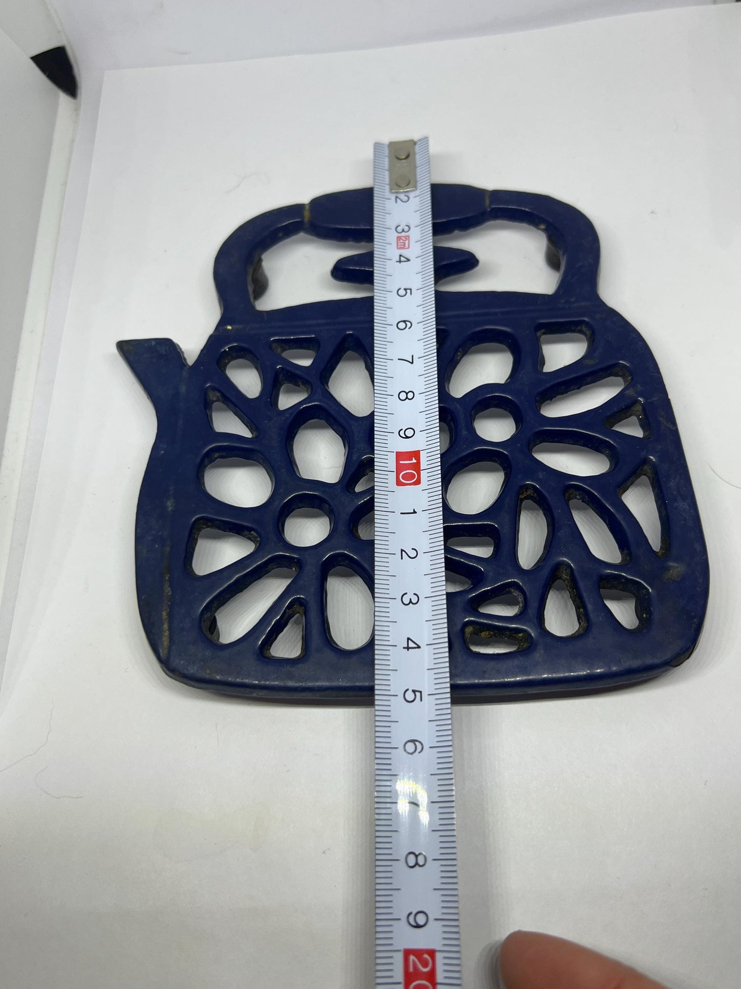 Vintage cast iron Trivet. Blue kettle teapot shaped 4 footed kitchen worktop saver trivet.