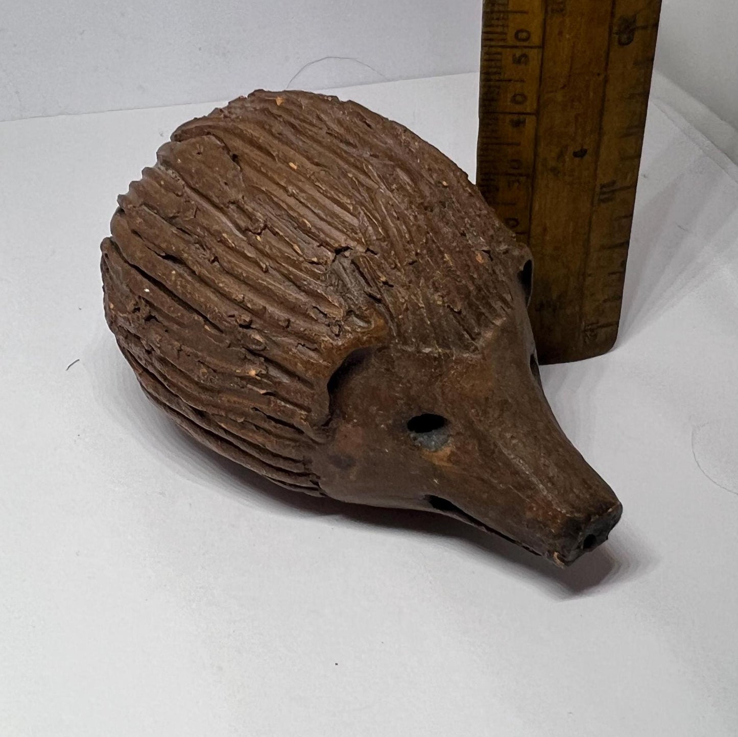 Terracotta hedgehog ornament.