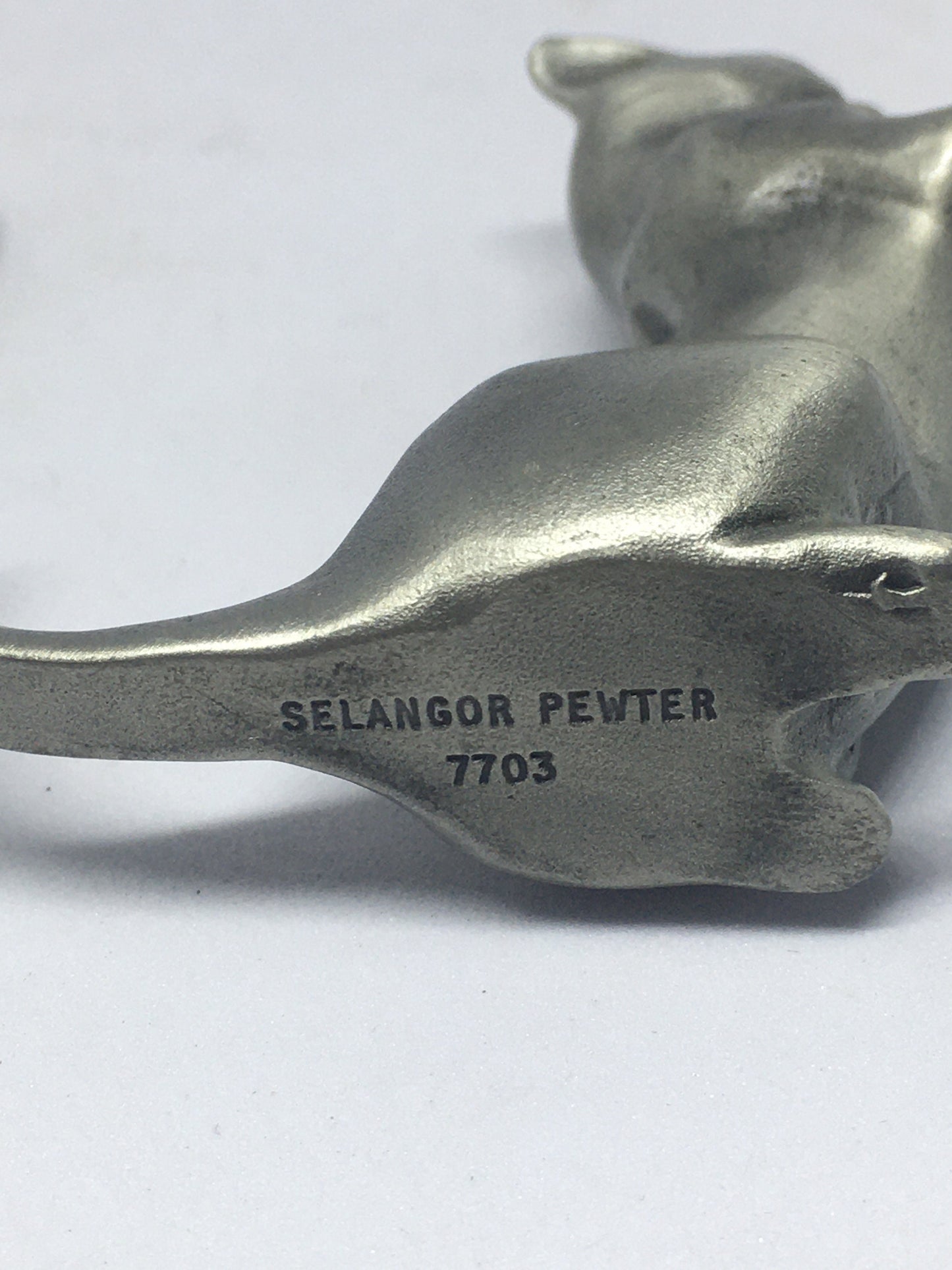 Two pewter cats.