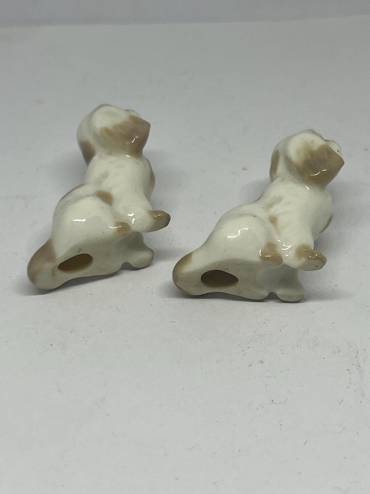 Pair of miniature Pekinese or Bolognese dogs. Hand painted Porcelain Lomonosov USSR dog figurines.