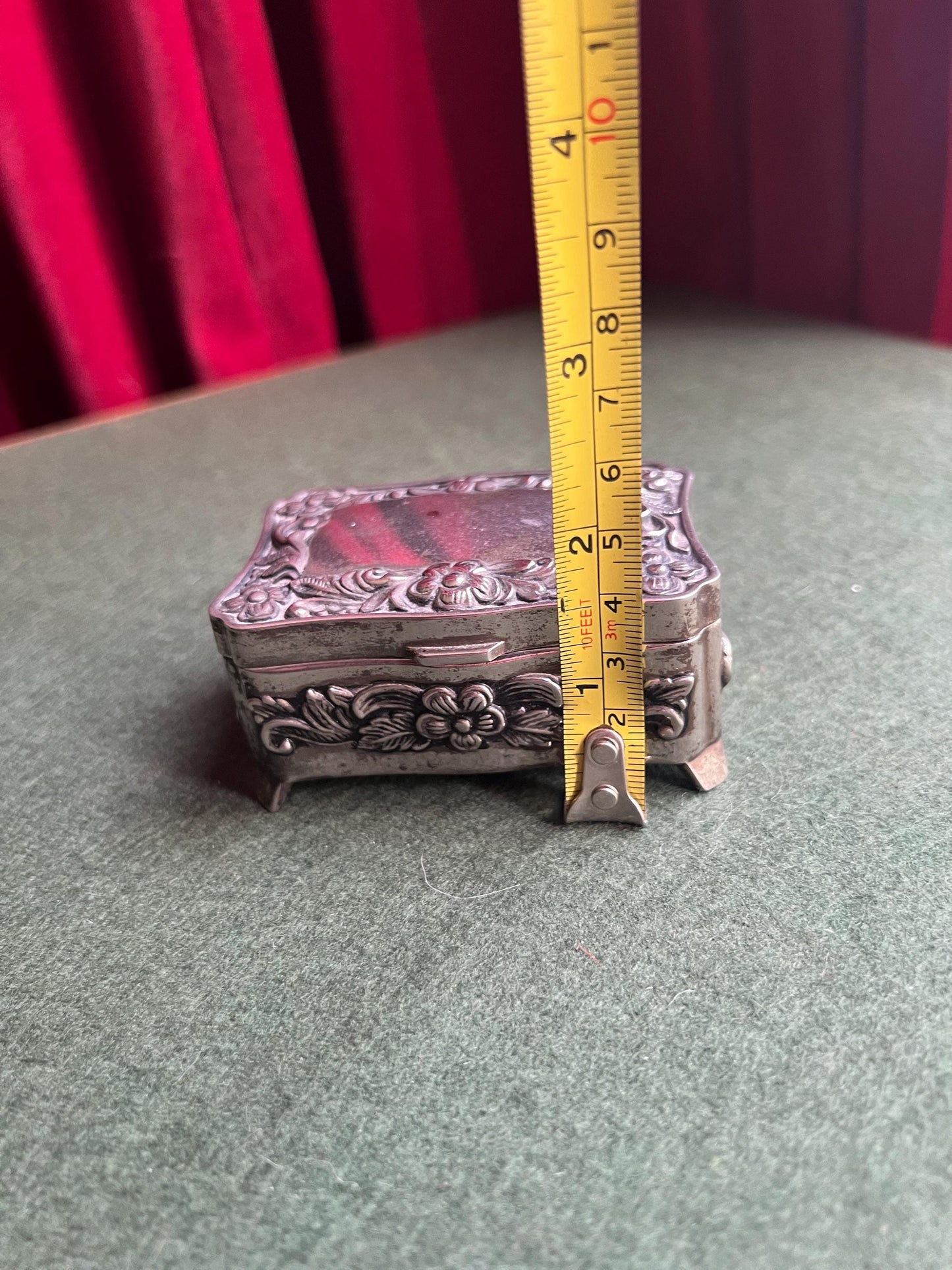 Vintage silver tone jewellery box. Embossed floral design treasure box blue lining.