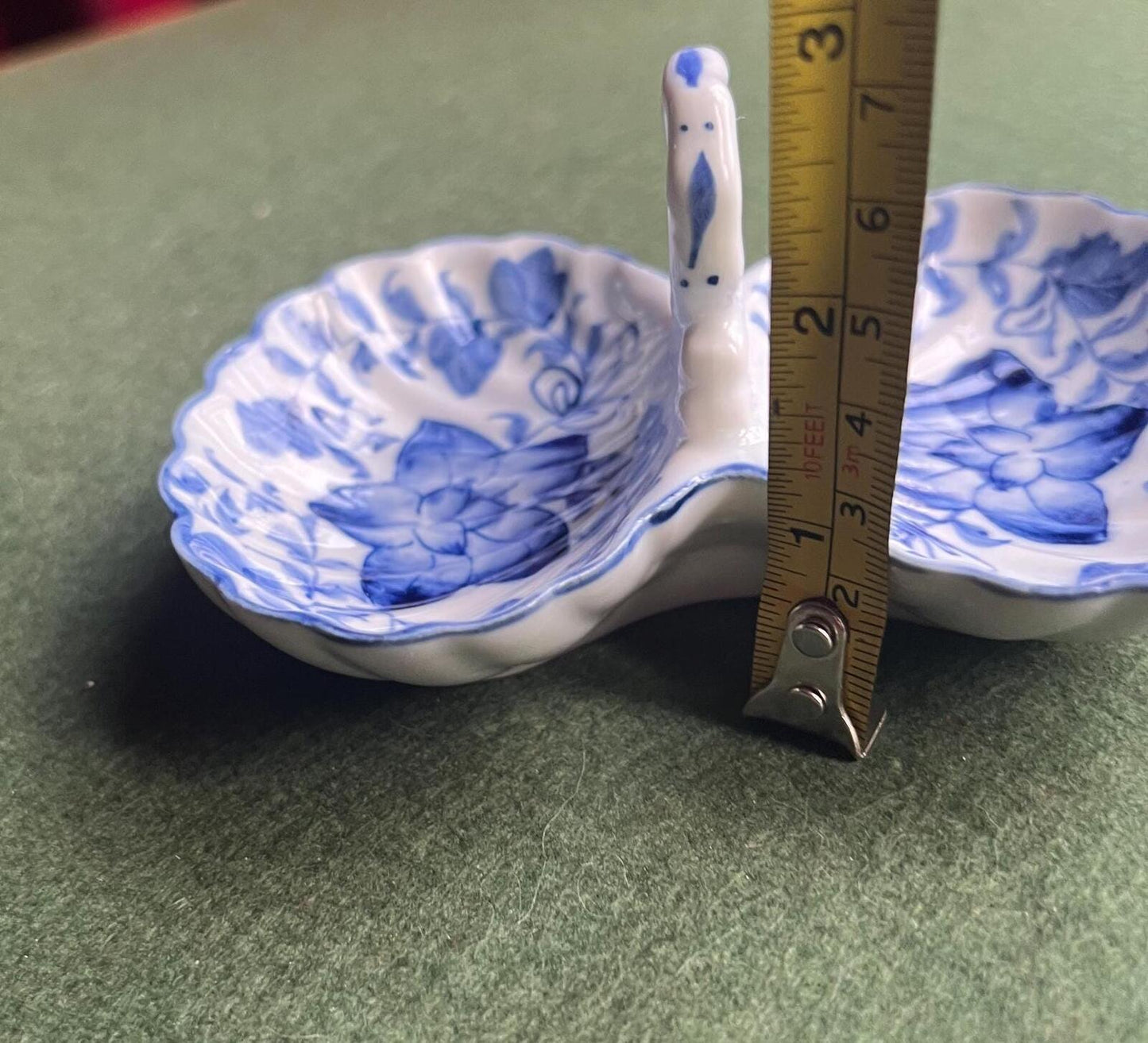 Vintage trinket dish. Ruffle edged handled blue white ceramic shell dish.