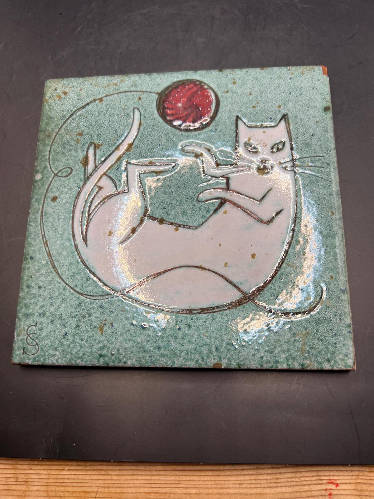 Hand made Cat tile signed Christina Shepherd original. White cat playing with a red balloon.