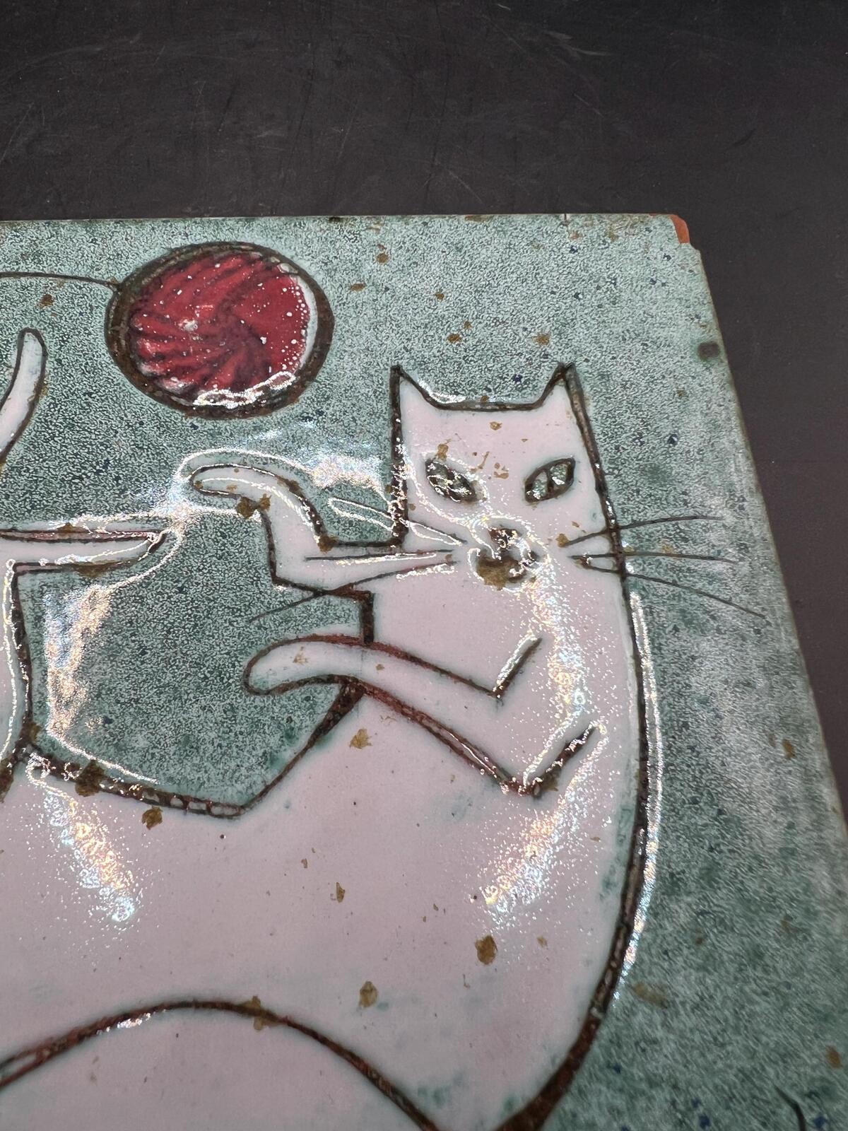 Hand made Cat tile signed Christina Shepherd original. White cat playing with a red balloon.
