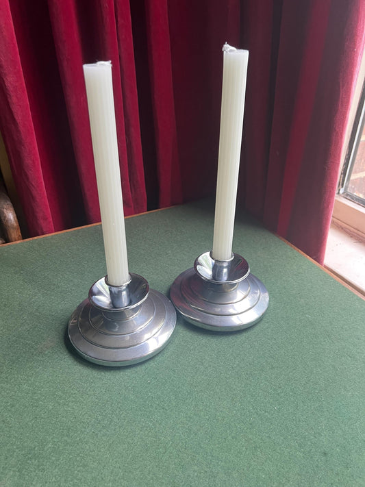 Pair of Art Deco style silver tone candlesticks. Stepped design metal candle holders.