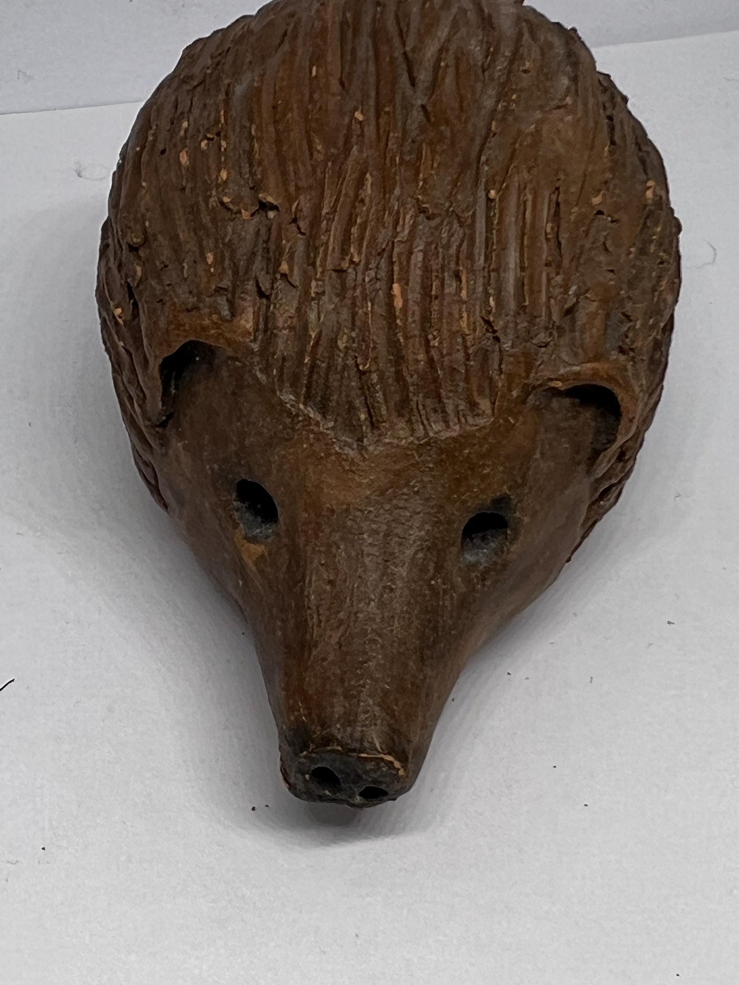 Terracotta hedgehog ornament.
