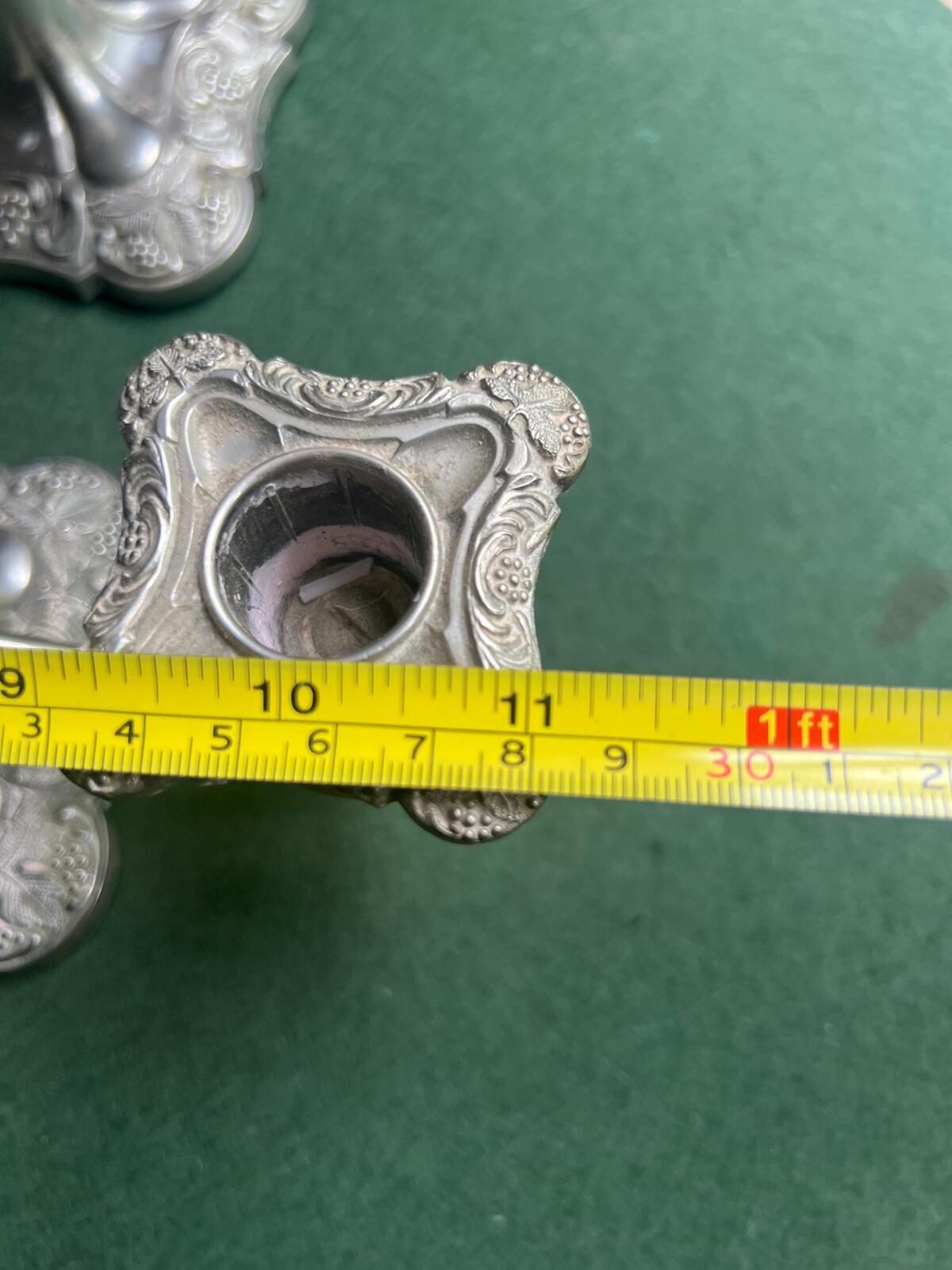 Pair of Vintage antique candlestick holders. Grape and vine pattern silver plated 3 arm candle holders. Mismatched heights.