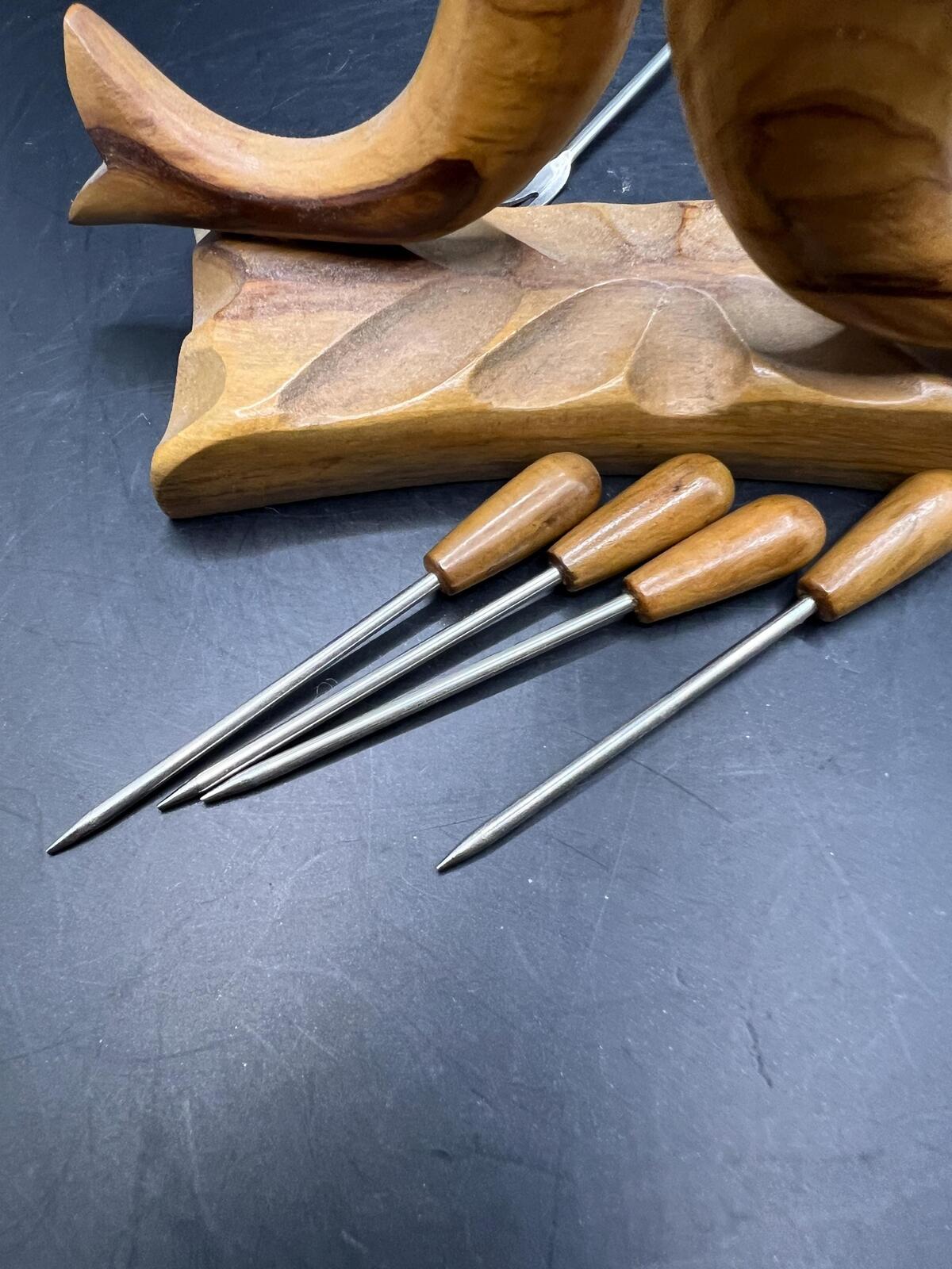 Wooden olive serving set. MCM carved olive wood fish design with 6 forks and 4 picks.