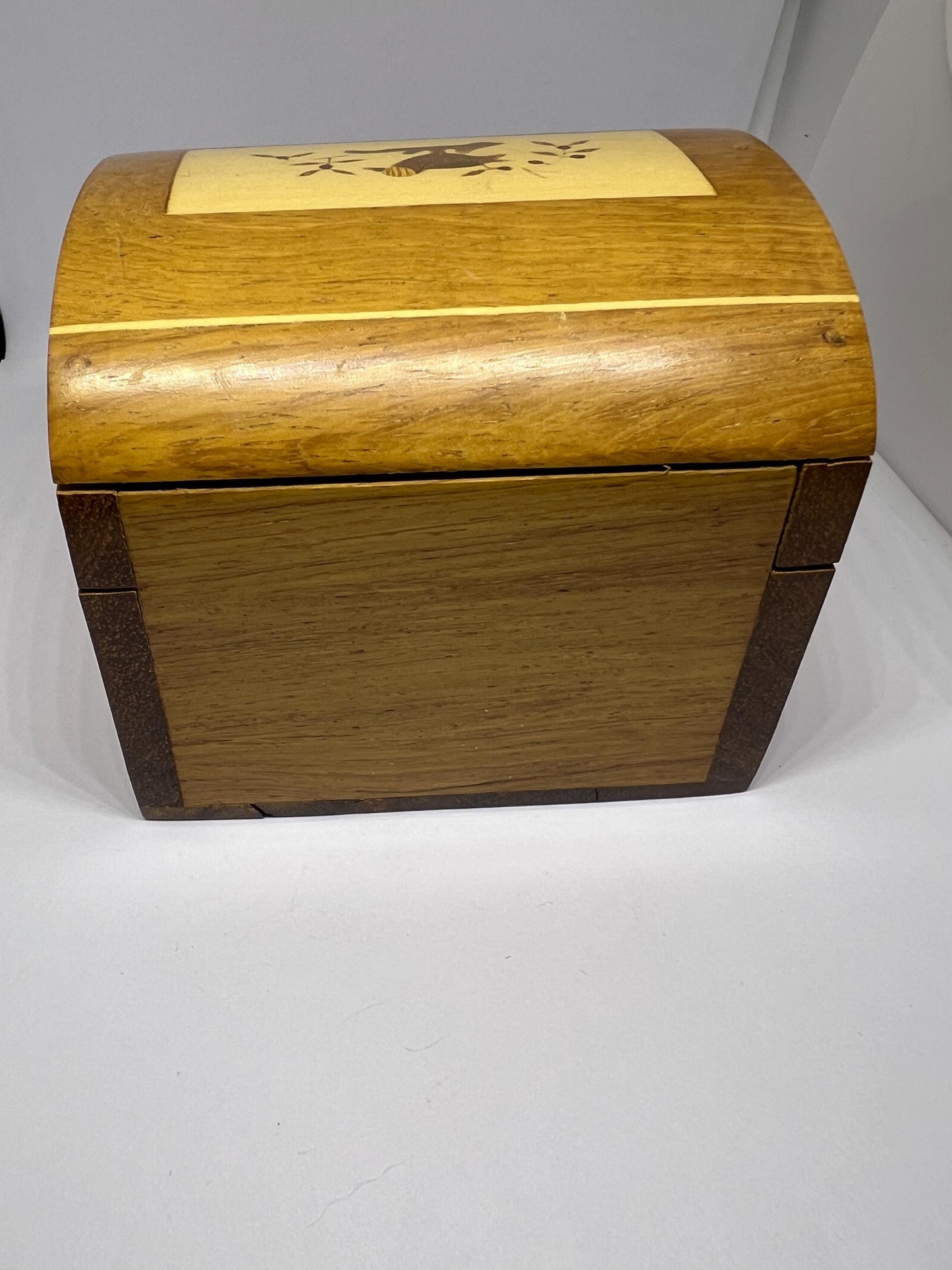 Wooden lidded secret lock treasure box. Inlaid marquetry bird themed domed jewellery box.