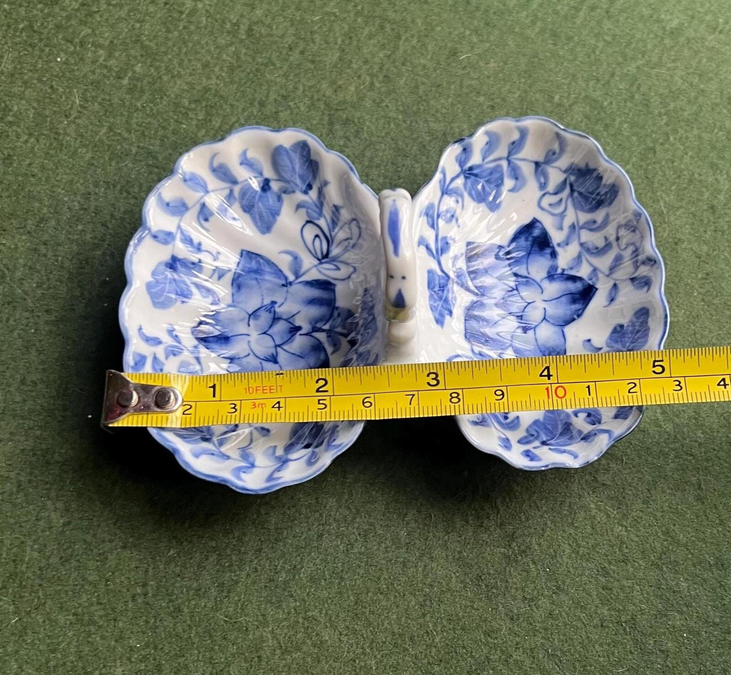 Vintage trinket dish. Ruffle edged handled blue white ceramic shell dish.