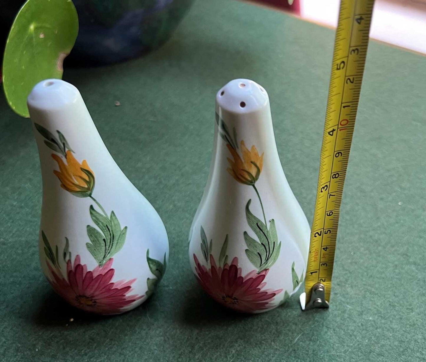 Ceramic salt and pepper shakers. Hand painted red and yellow flowers. Radford.
