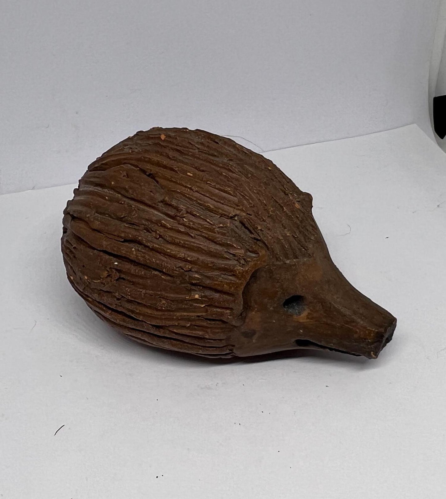 Terracotta hedgehog ornament.