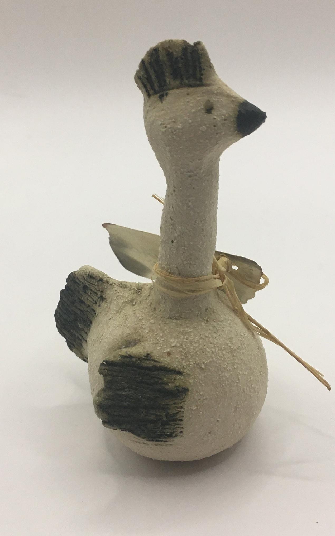 Quirky sitting bird with comb. Handmade by Hafdis.
