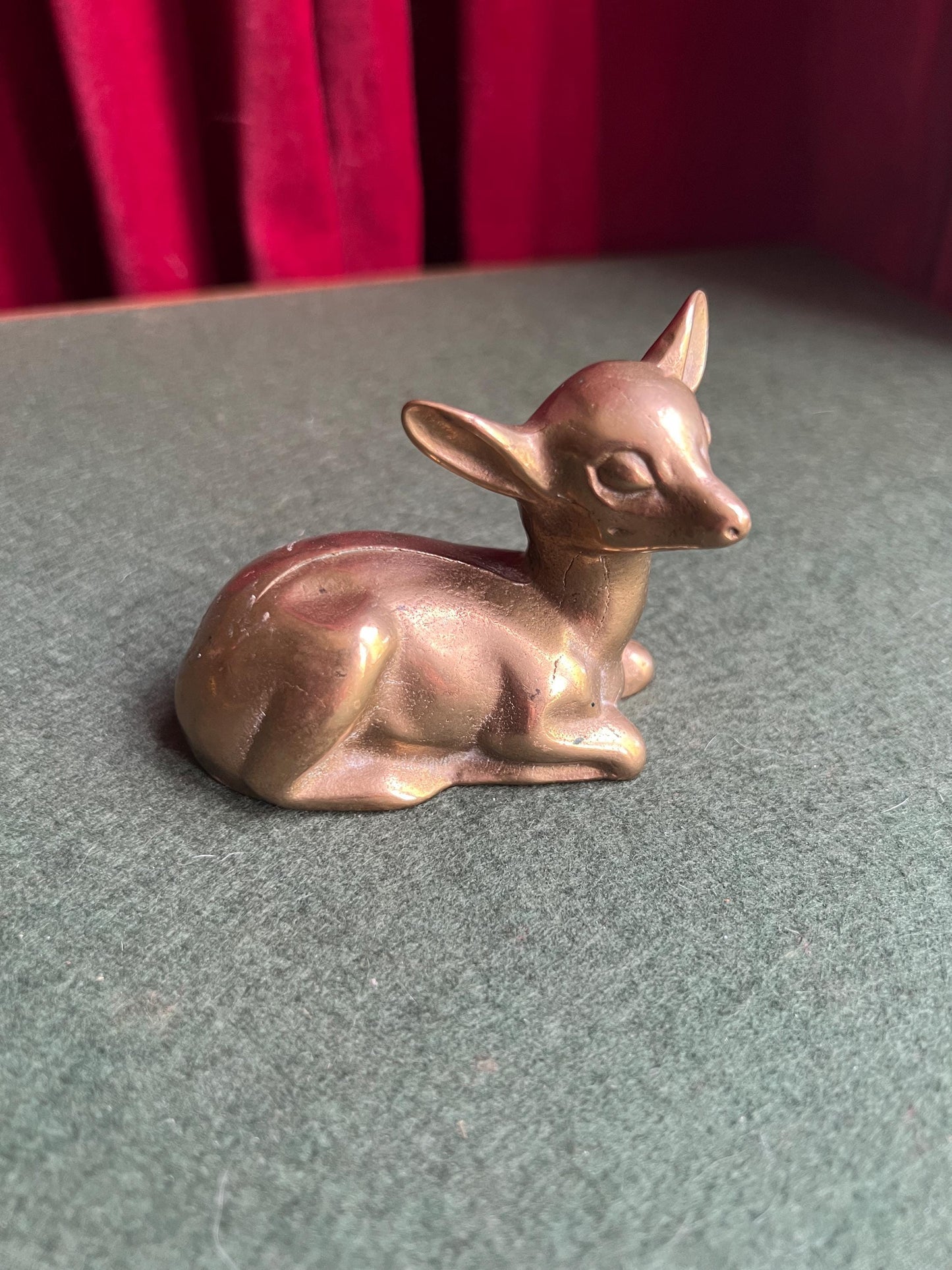 Vintage brass deer figurine. Resting fawn brass paperweight.