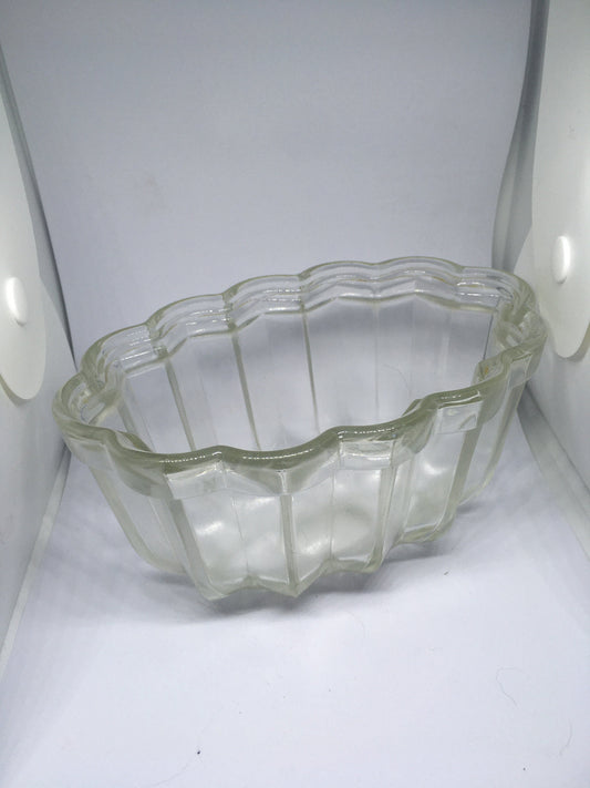 Vintage glass jelly mould. Clear pressed glass with scalloped edge. 10cm deep 16cm long.