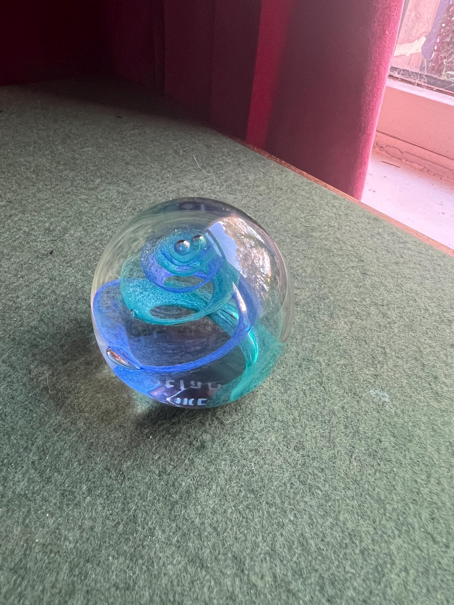 Vintage paperweight. Blue swirl in clear glass. Stamped Twirl Caithness Scotland.