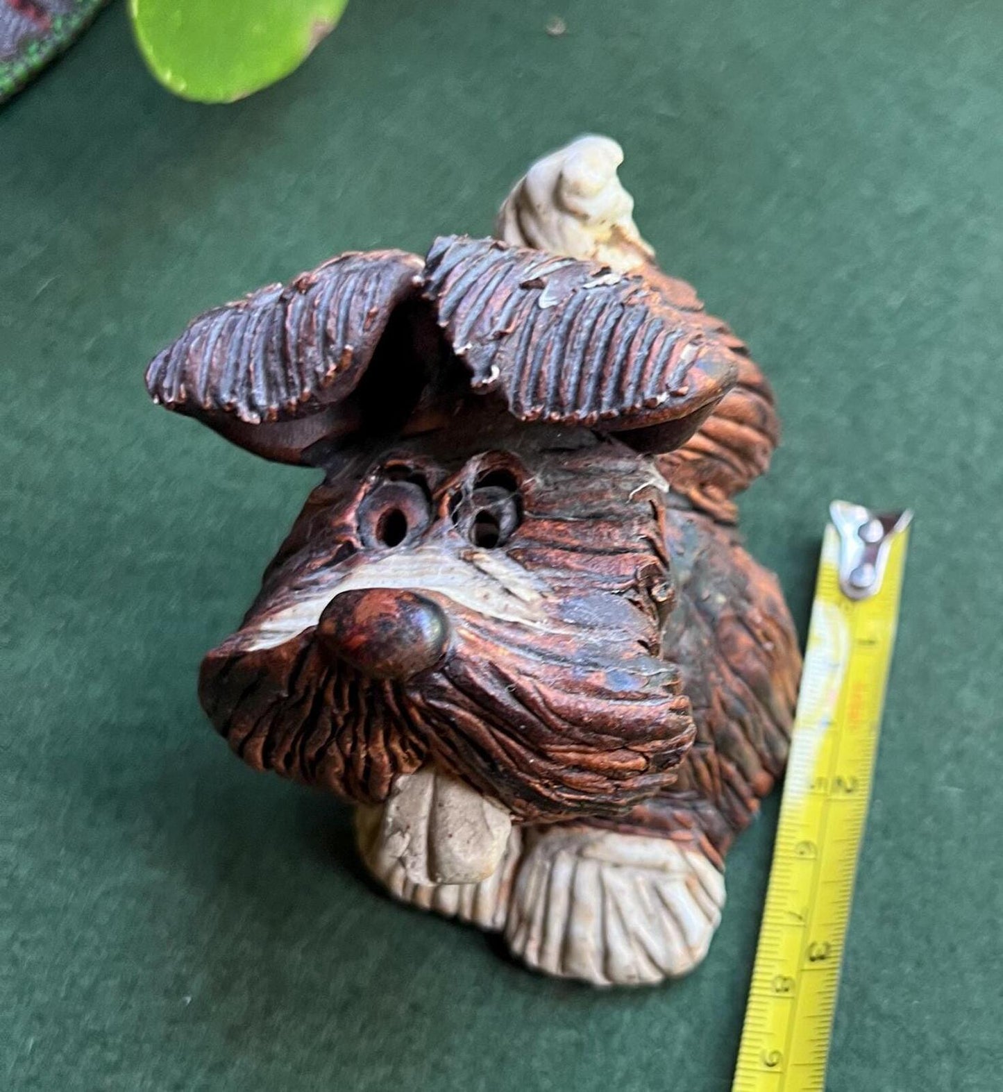 Hand built studio pottery brown glazed dog with its tongue out and quirky ears.