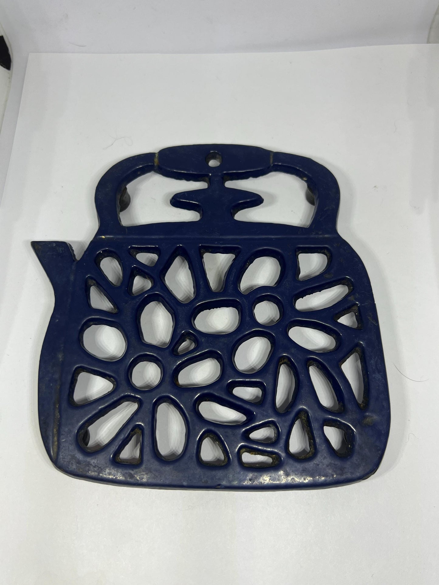 Vintage cast iron Trivet. Blue kettle teapot shaped 4 footed kitchen worktop saver trivet.