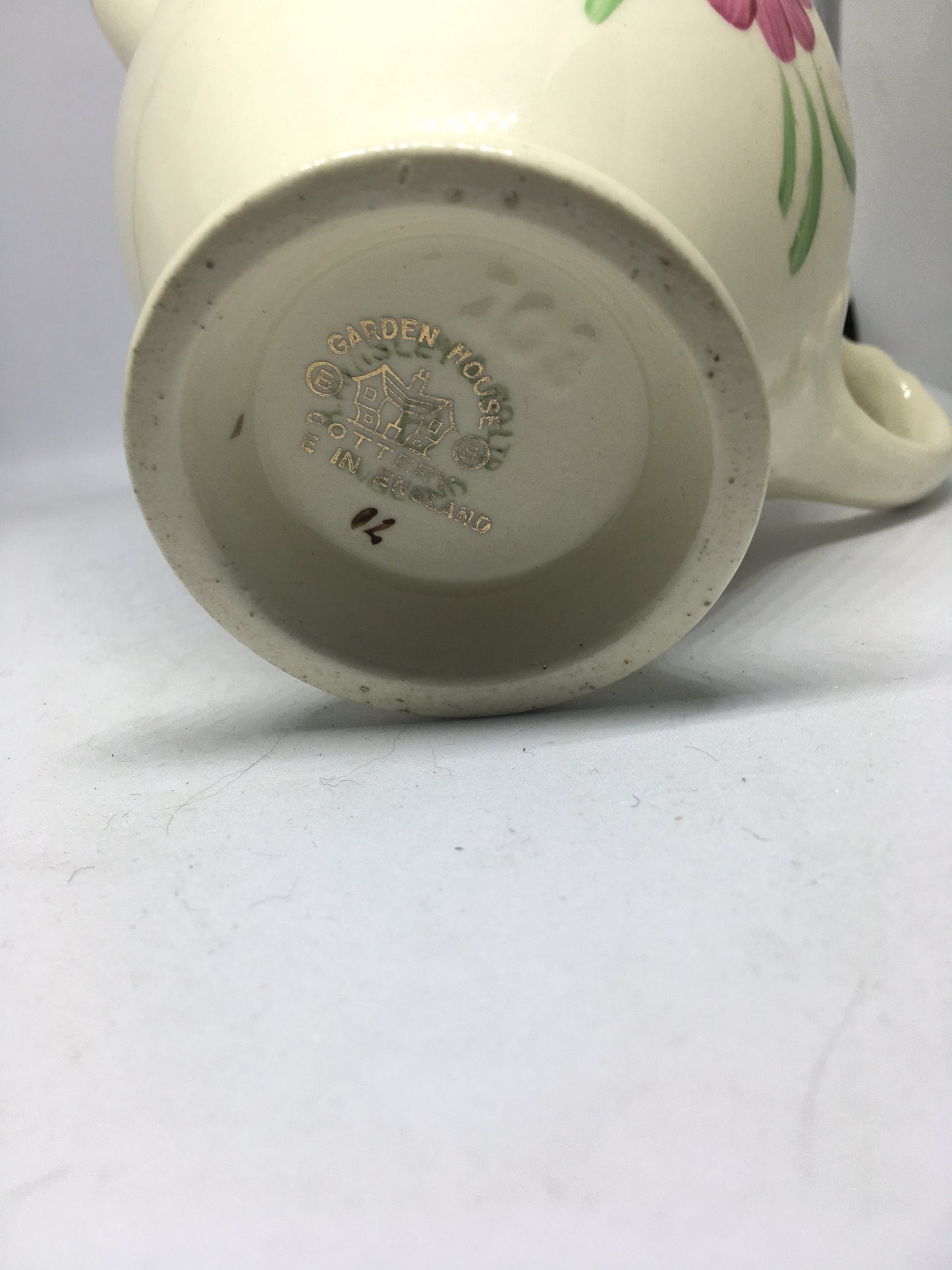 Ceramic hand painted milk jug. Stamped Ainsley England.