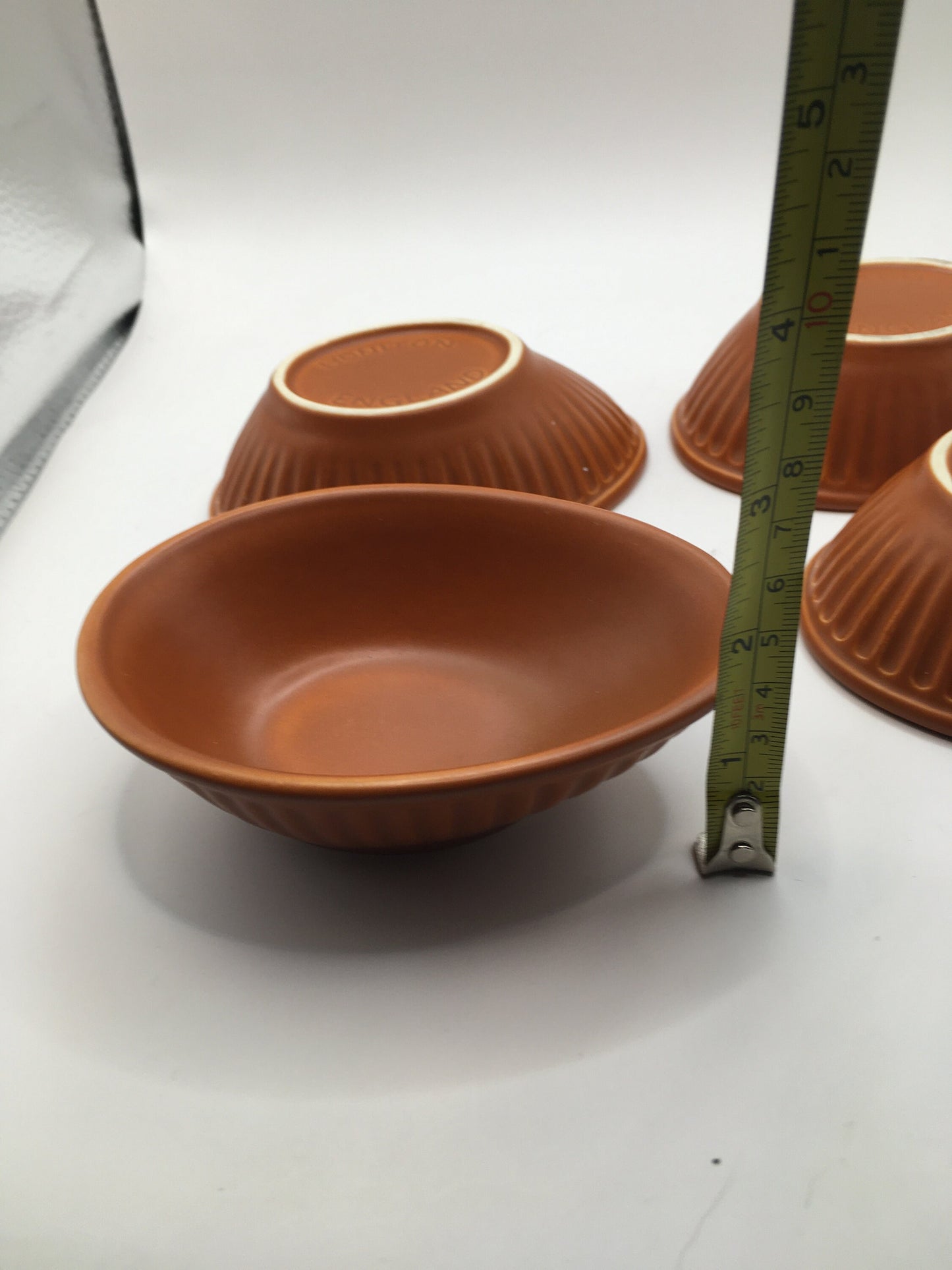 Honiton Pottery Avocado dishes. Set of 4 orange glazed stripe edged set.
