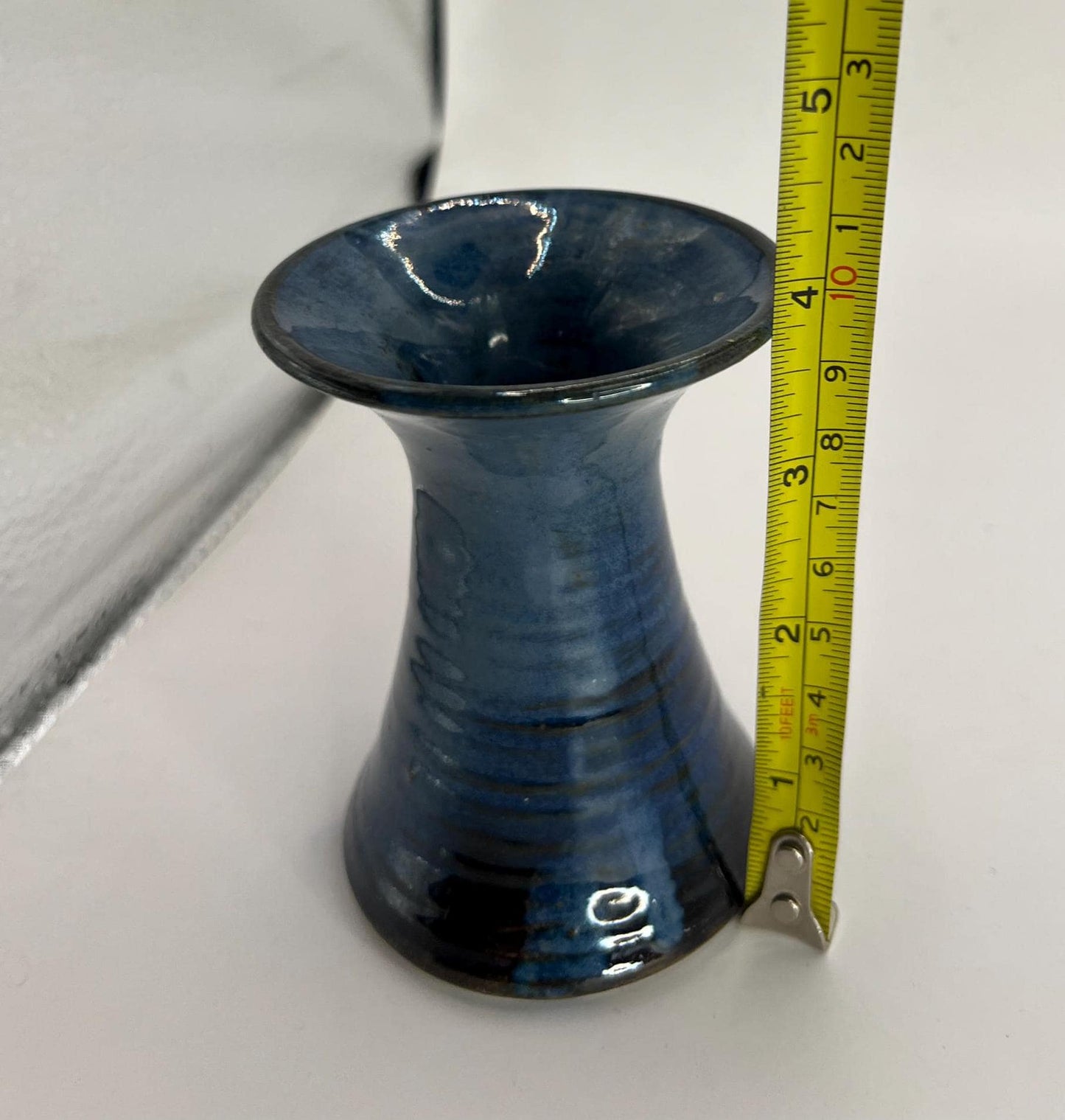 Blue black glaze trumpet vase. Marked 'aino'.