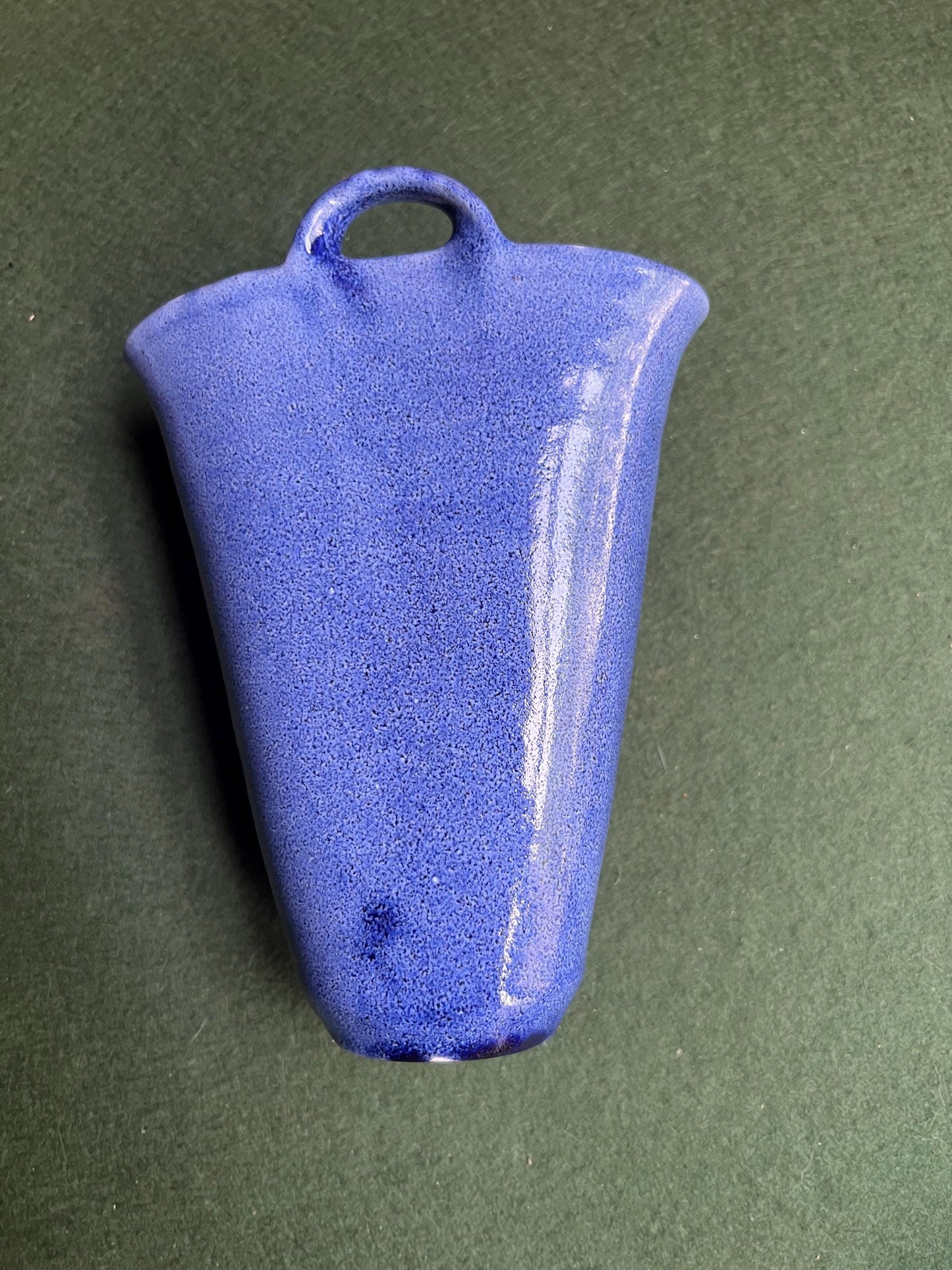 Studio pottery wall pocket. Blue glaze posy vase floral butterfly decor.