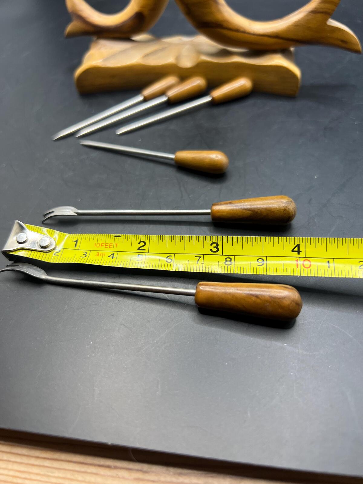 Wooden olive serving set. MCM carved olive wood fish design with 6 forks and 4 picks.
