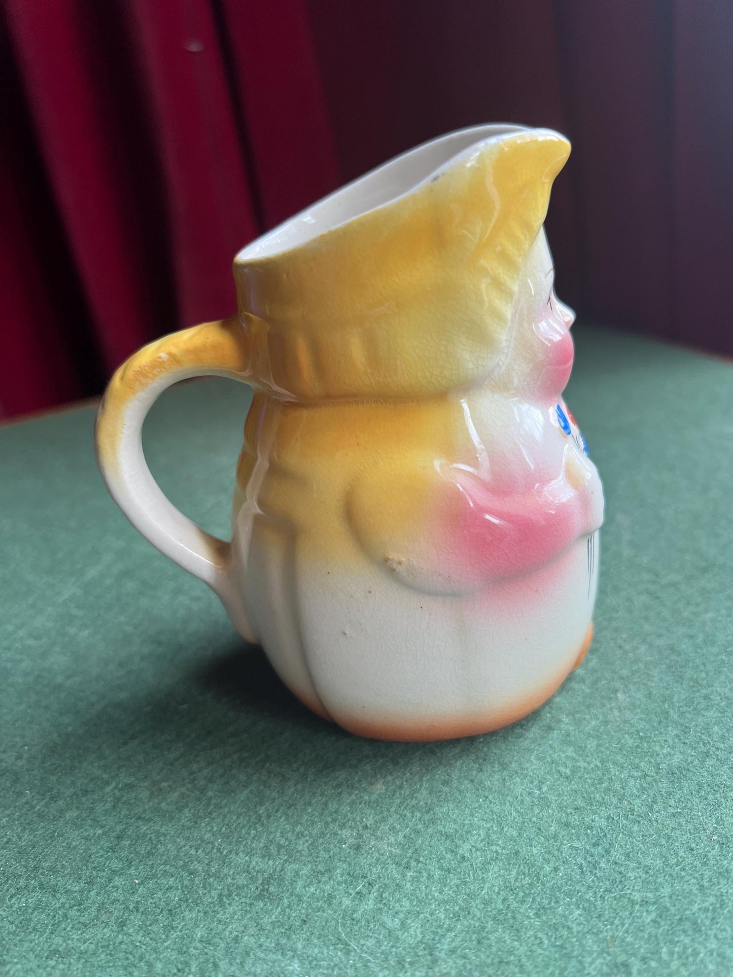 Erphila Czechoslovakia hand painted lady holding flowers vase milk jug.