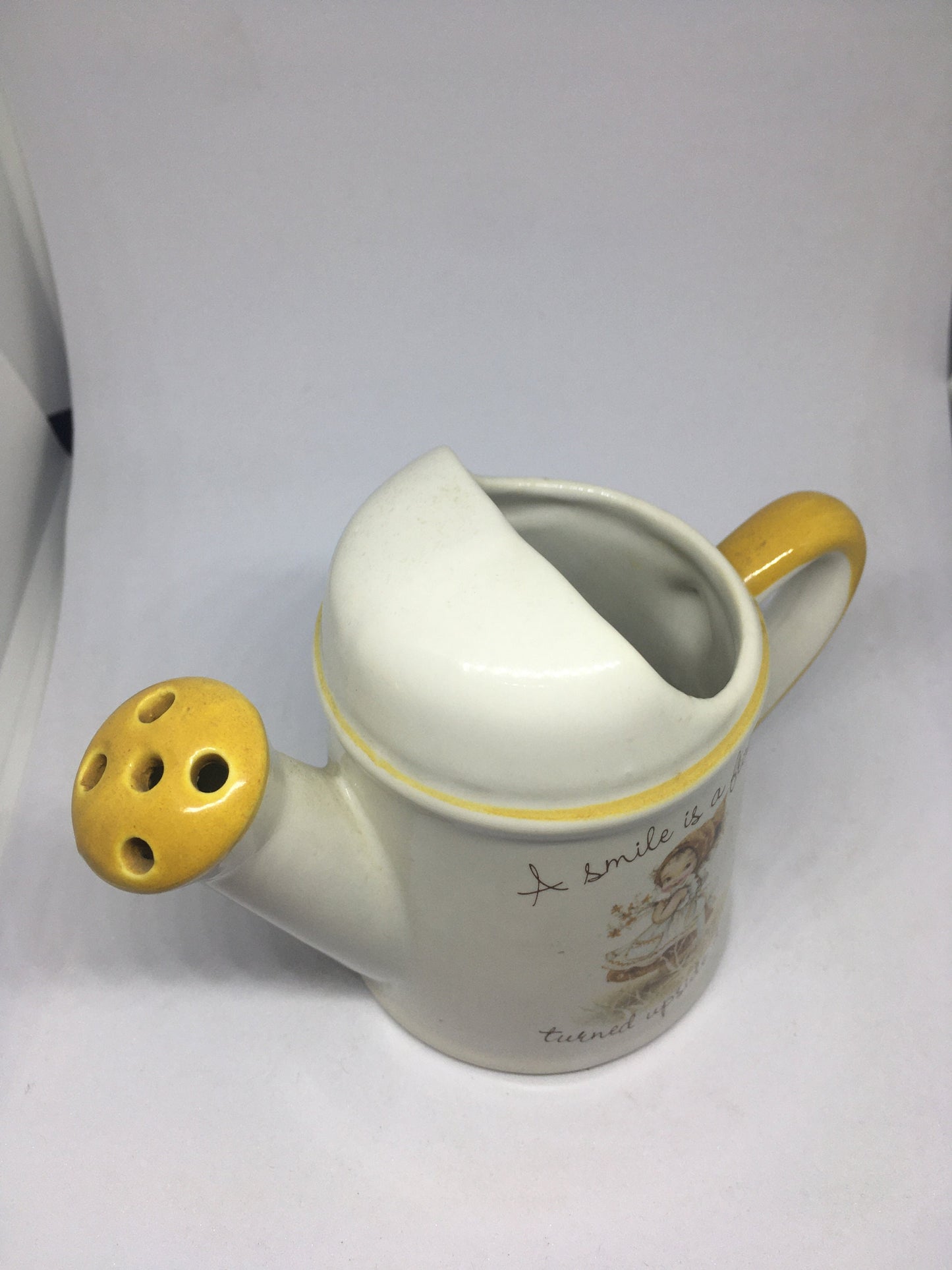 Ceramic watering can Vintage Gretchen Stoneware ceramic watering can ornament. 1970s kitsch. A smile is a frown turned upside down.