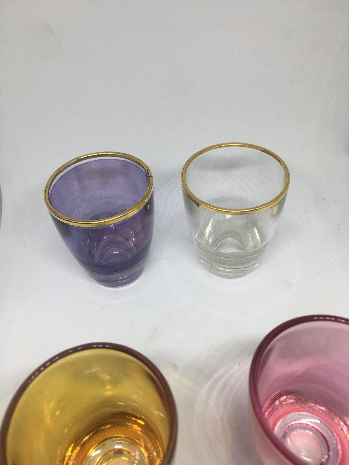 1950s Harlequin glass 6 shot glasses in wire holder.