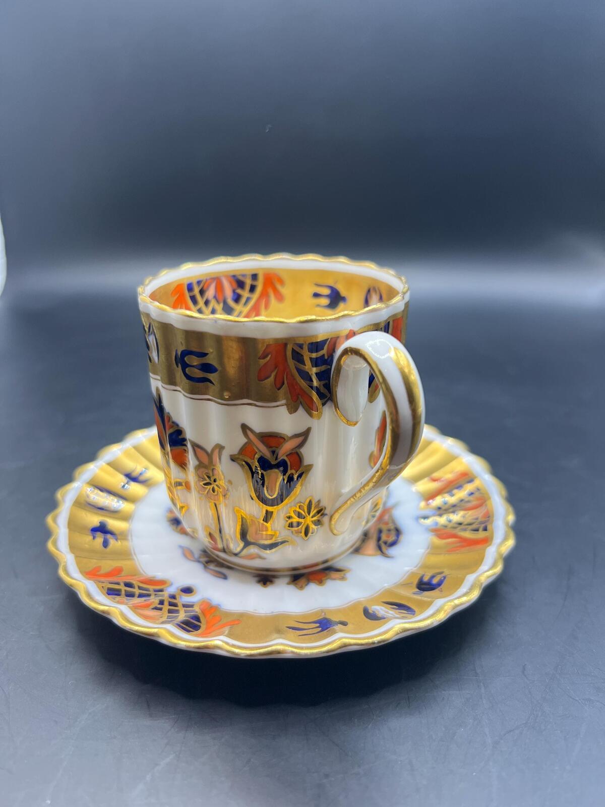 Antique coffee can / tea cup and saucer. Vibrant Imari pattern with gold gilt. Stamped Copeland 5.257. AS IS