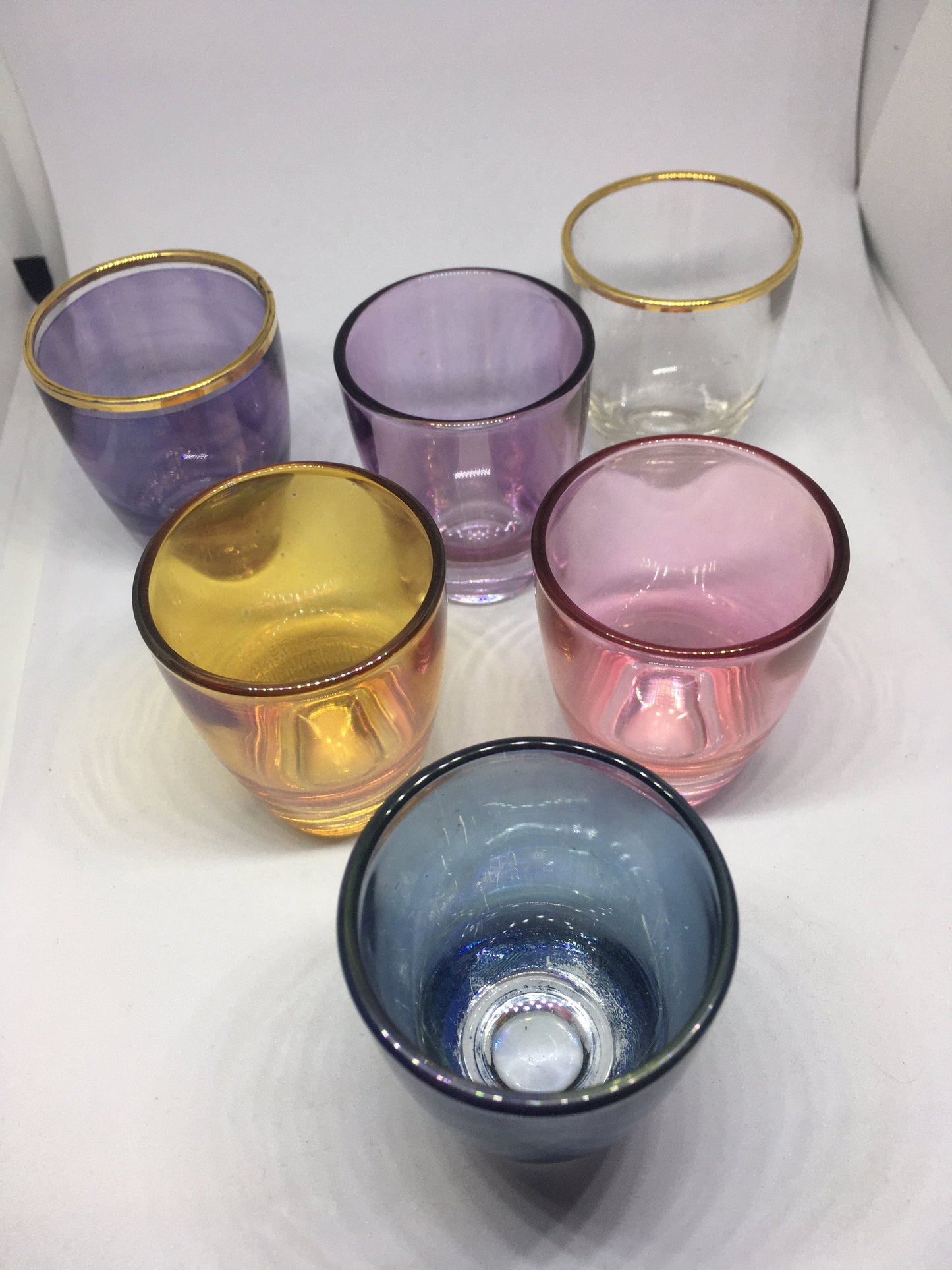 1950s Harlequin glass 6 shot glasses in wire holder.