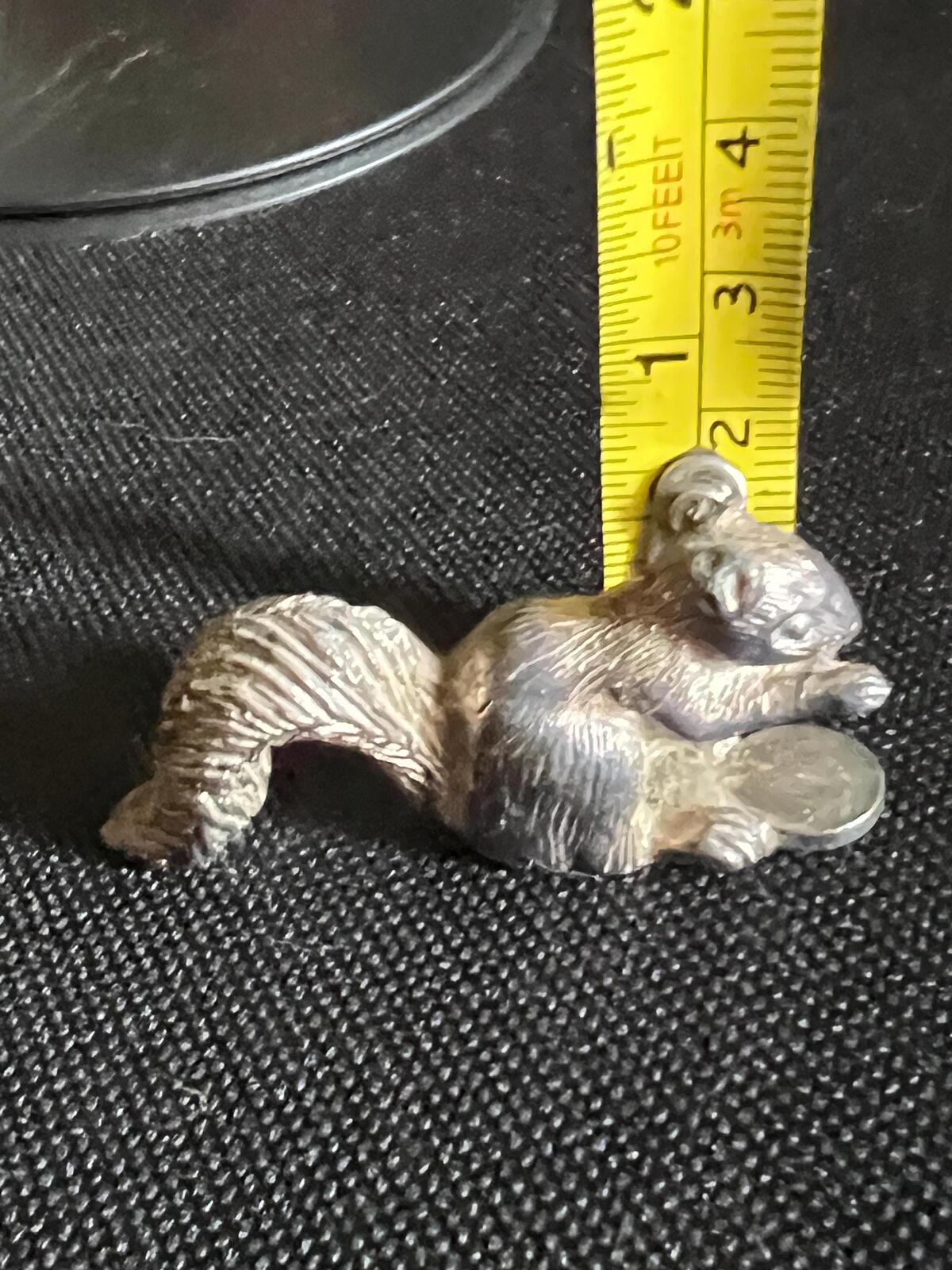 Vintage silver tone squirrel figurine. Miniature metal squirrel ornament.