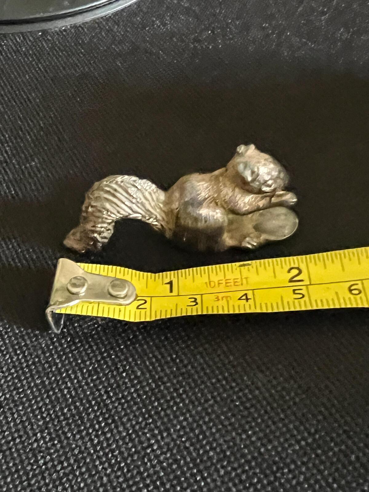 Vintage silver tone squirrel figurine. Miniature metal squirrel ornament.