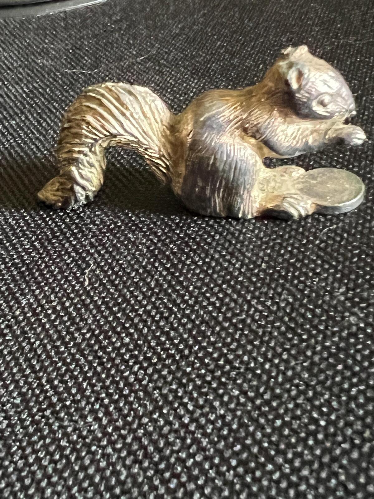 Vintage silver tone squirrel figurine. Miniature metal squirrel ornament.
